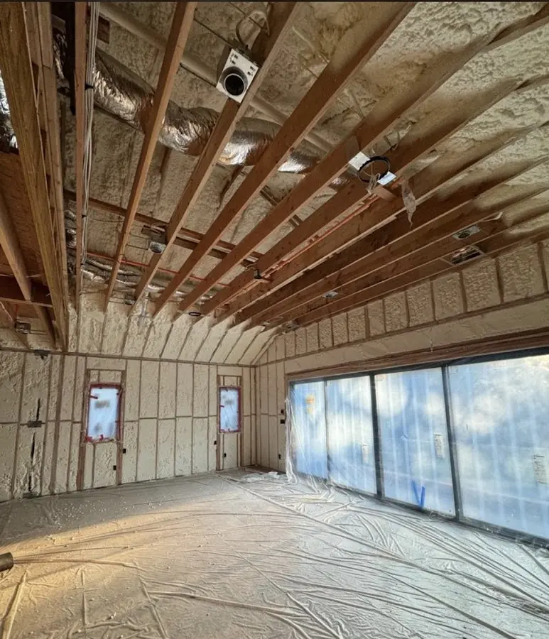 Interior walls and ceiling insulated with spray foam during new construction in Pine Ridge